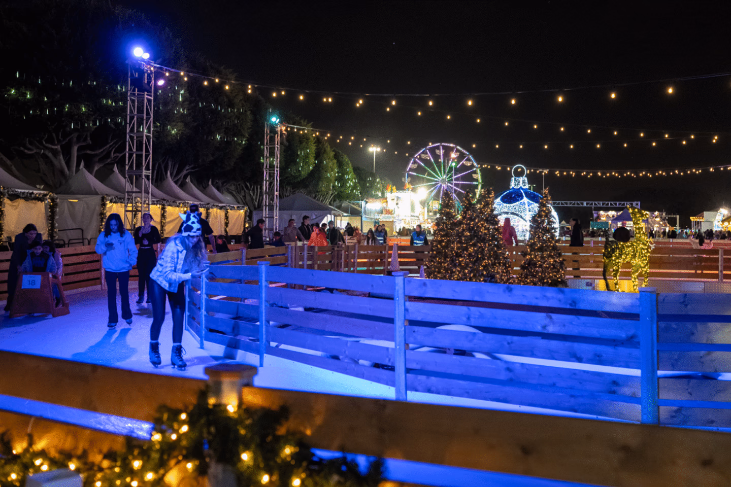 Winter Fest OC ice trail surrounded by Christmas trees, ornaments and holiday lights