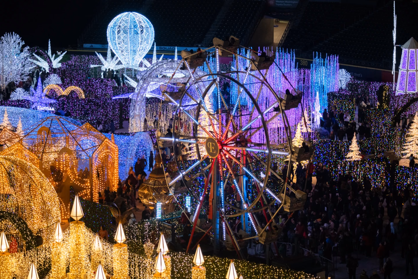 Enchant Christmas light maze and illuminated Ferris wheel at Santa Anita Park